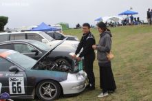 Wei Li, from Christchurch, adds oil to his Honda Integra